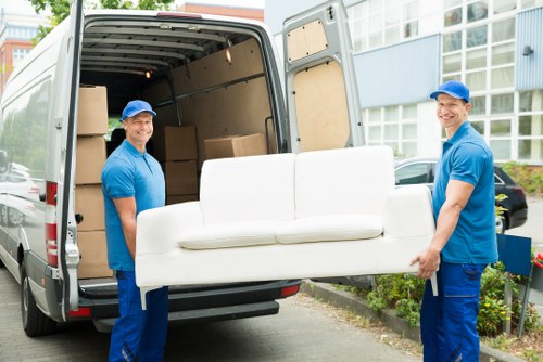 Man with a van loading furniture for a local Barnet move