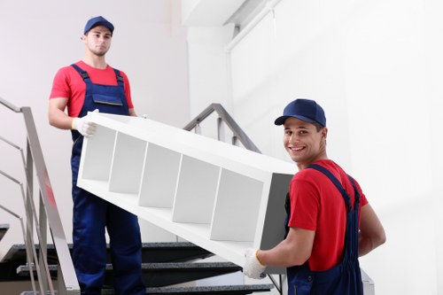 Furniture removals team handling household items in Barnet