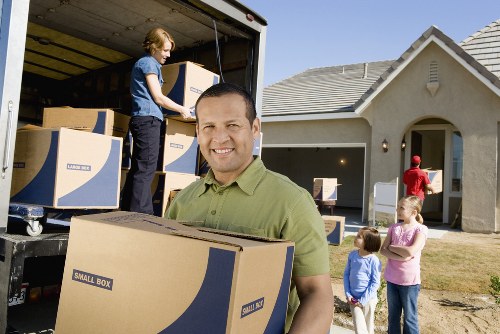Packed office boxes and furniture ready for a commercial move